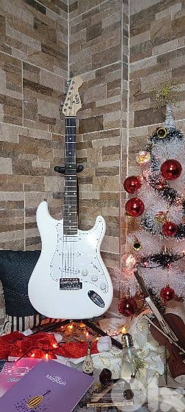 electric guitar with bag and cable and picks free 1