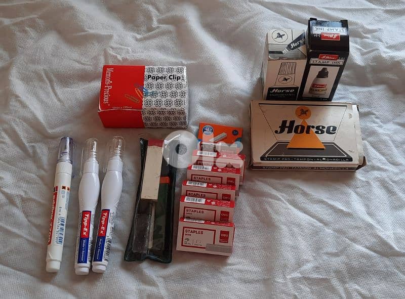 Staples, Tipex, paper clip, and stamp pad & ink 0