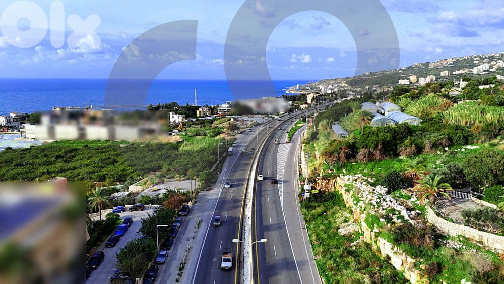 HIGHWAY LAND 1305 SQM IN AMCHIT- JBEIL/عمشيت REF#JE100372 1