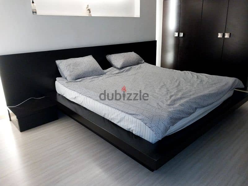 bedroom with bed side table and dressing table with mirror 2