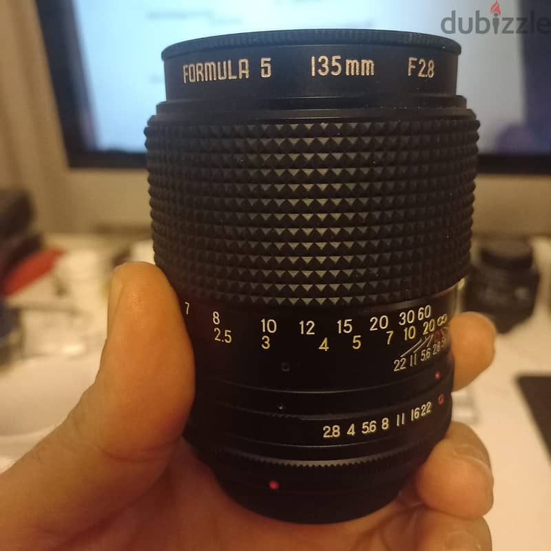 2 Nikon SLR  Lenses - 2 Panasonic i think G40 Lenses 2
