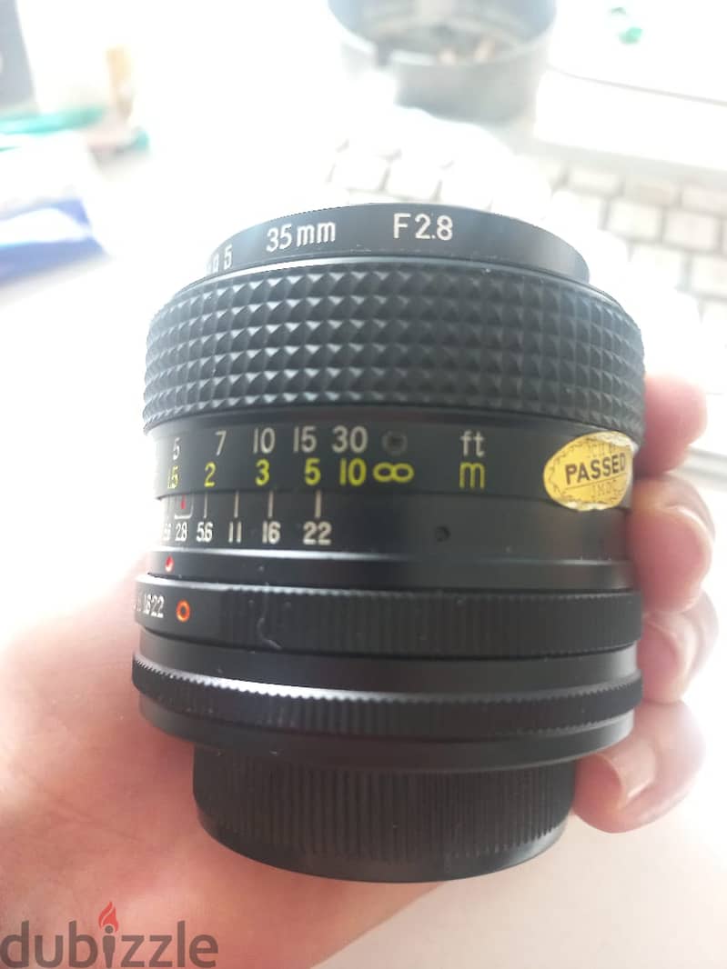 2 Nikon SLR  Lenses - 2 Panasonic i think G40 Lenses 1