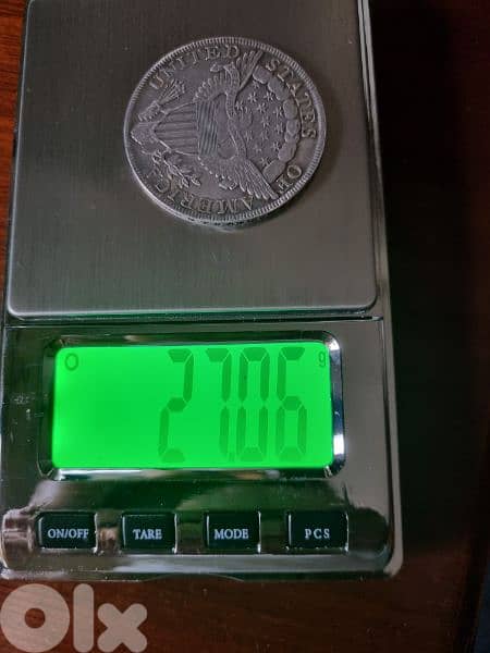 A silver old coin 7 dollars the gram 0