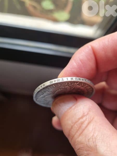 A silver old coin 7 dollars the gram 1