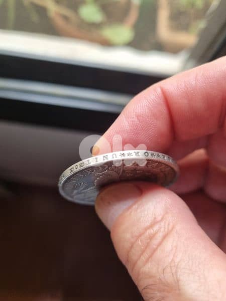 A silver old coin 7 dollars the gram 2