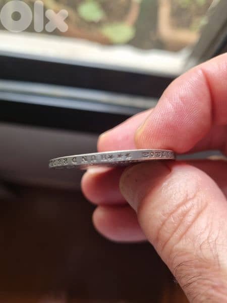 A silver old coin 7 dollars the gram 3