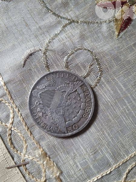 A silver old coin 7 dollars the gram 5