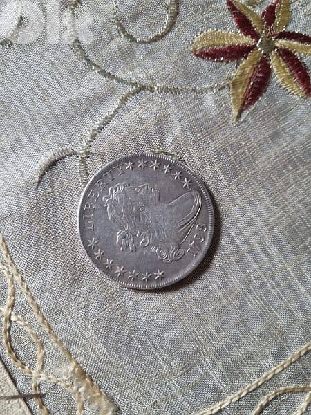 A silver old coin 7 dollars the gram 6