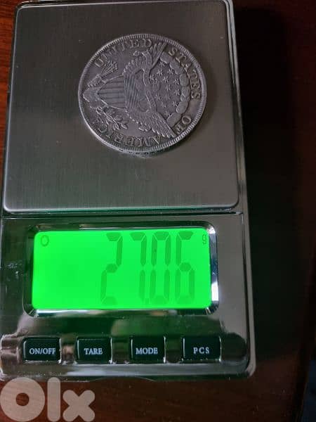 A silver old coin 7 dollars the gram 9