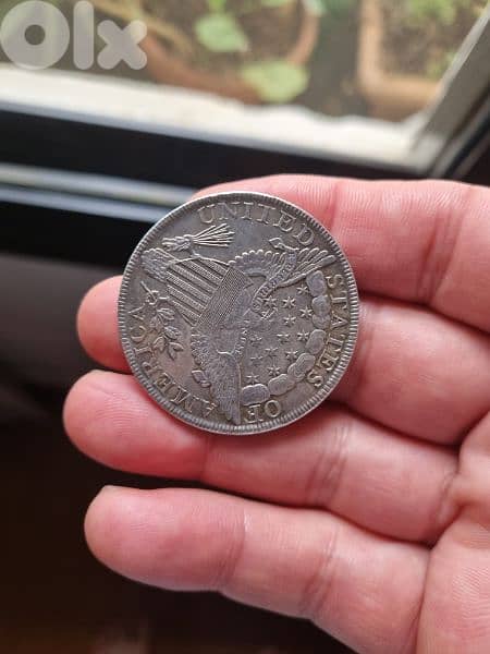 A silver old coin 7 dollars the gram 10