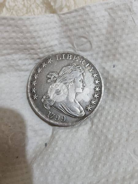 A silver old coin 7 dollars the gram 12