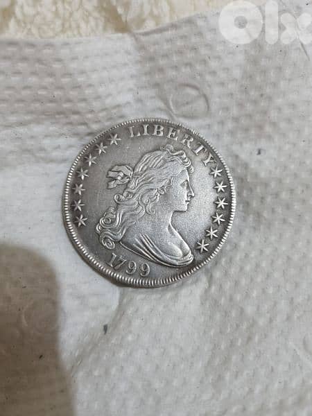 A silver old coin 7 dollars the gram 13