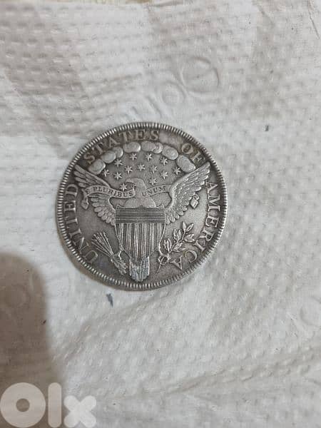 A silver old coin 7 dollars the gram 14