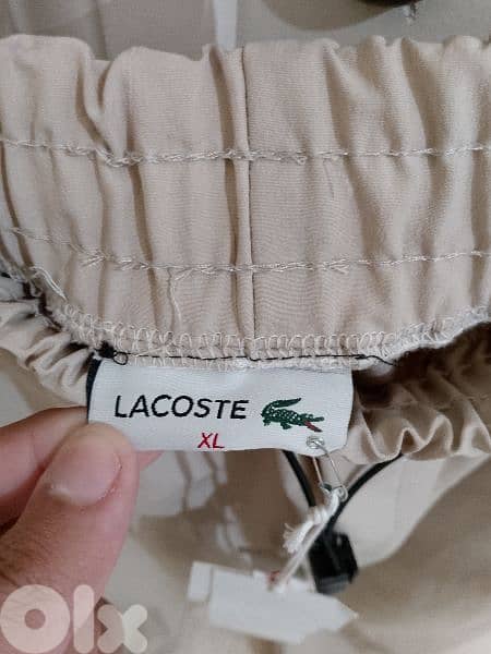 بنطلون رجالي قماش بعدو جديد ماركة LACOSTE قياس XL السعر 15$ 6