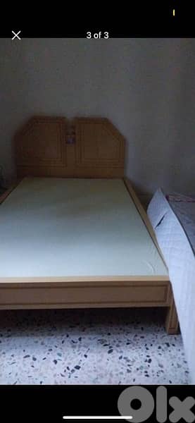 2 wooden beds with mattresses 1
