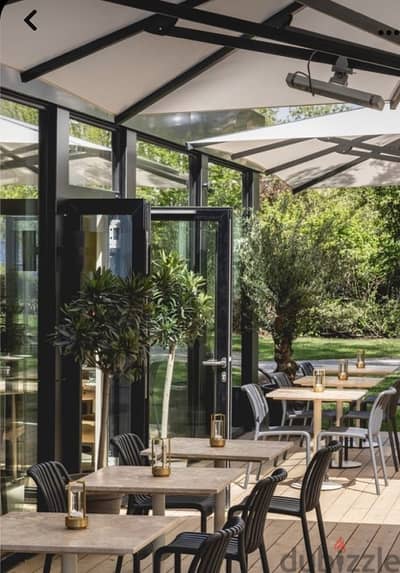 High ceiling open space with terrace rest bar lounge pilates studio