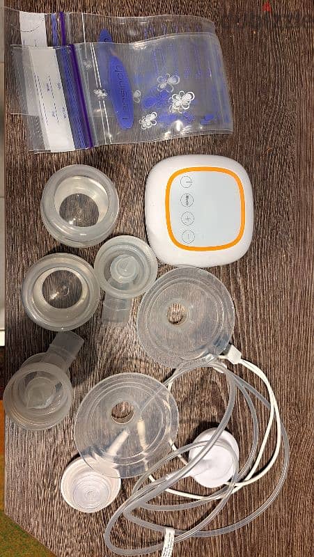 breast pump with milk storing bags 2