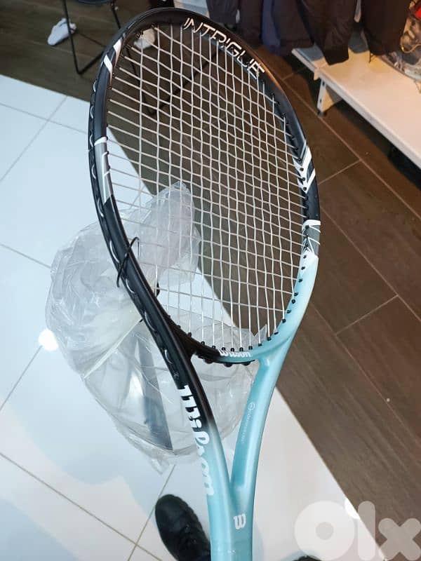 aqua blue Wilson tennis racket 0