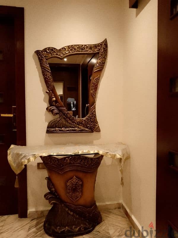 antic intrance decoration with a mirror 0
