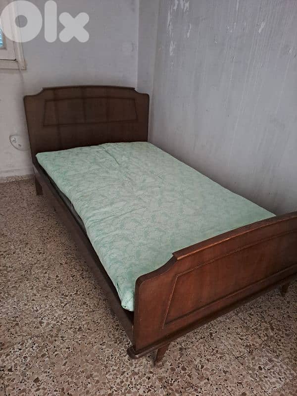 wooden bed and mattress for 85 dollars 0
