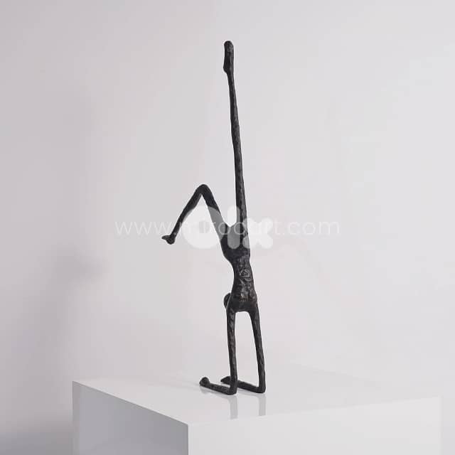 Stillness in Motion Sculpture – Abstract Black Metal Handstand Figure 1