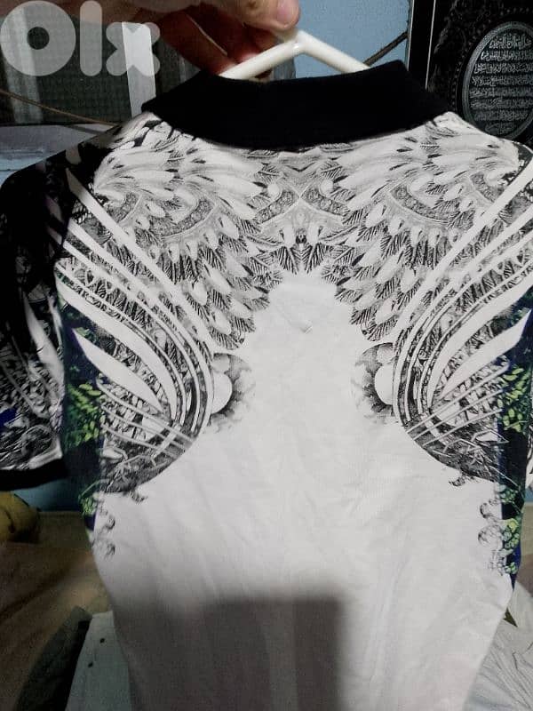 White and black T-shirt. 1