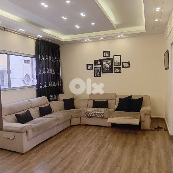 L-Shaped Living Room with a Recliner 0