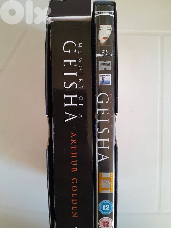 "Memoirs of a Geisha" by Arthur Golden, includes both the book and DVD 3