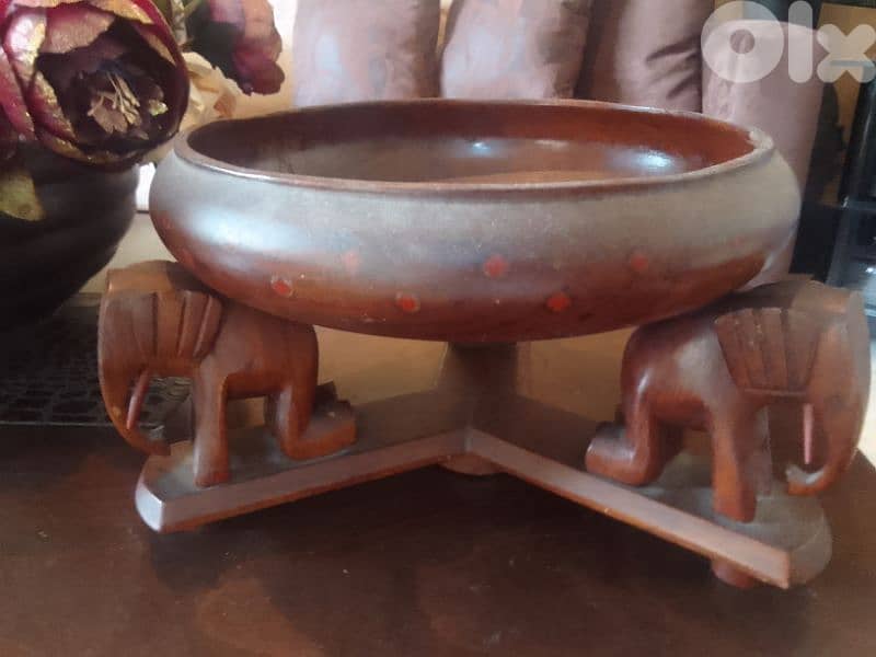 100 years old wooden plate with elephants 0