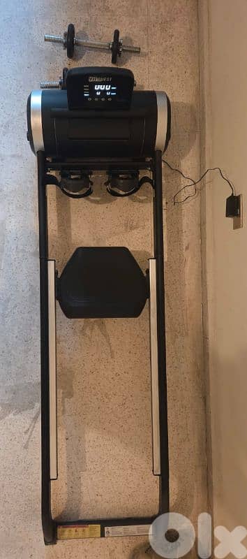 rowing machine and dumbles 0