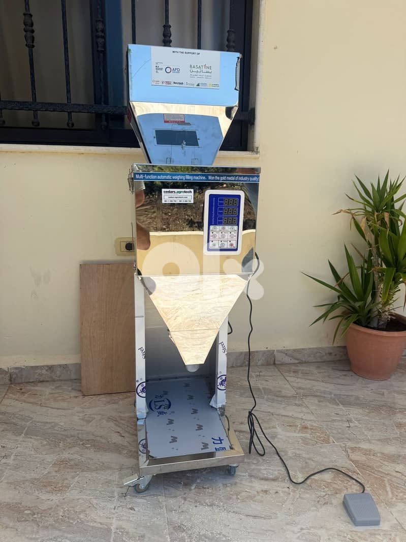 Manual Packaging Machine For Grains  آلة تعبئة الأكياس اليدوية للحبوب 2