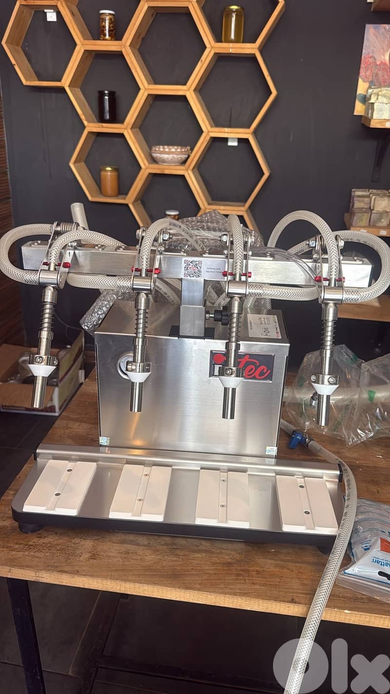 Filling machine of 4 heads(For Liquids) (آلة تعبئة بأربع رؤوس (للسوائل 1