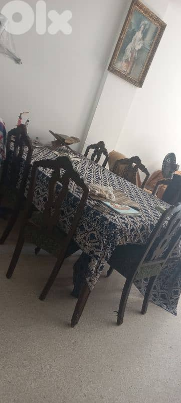 dining table with eight chairs and chiffonier and chandeliers 9