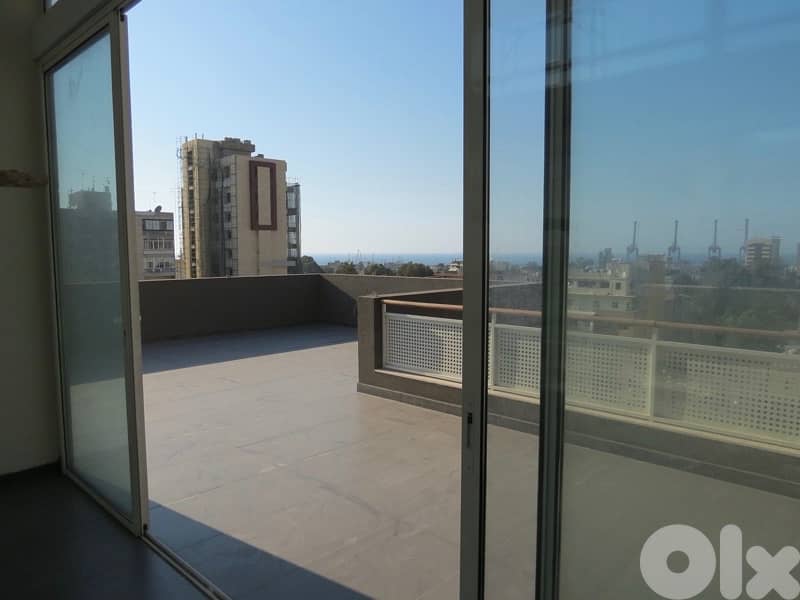 Spacious penthouse with terrace & open sea view for sale in Achrafieh 0