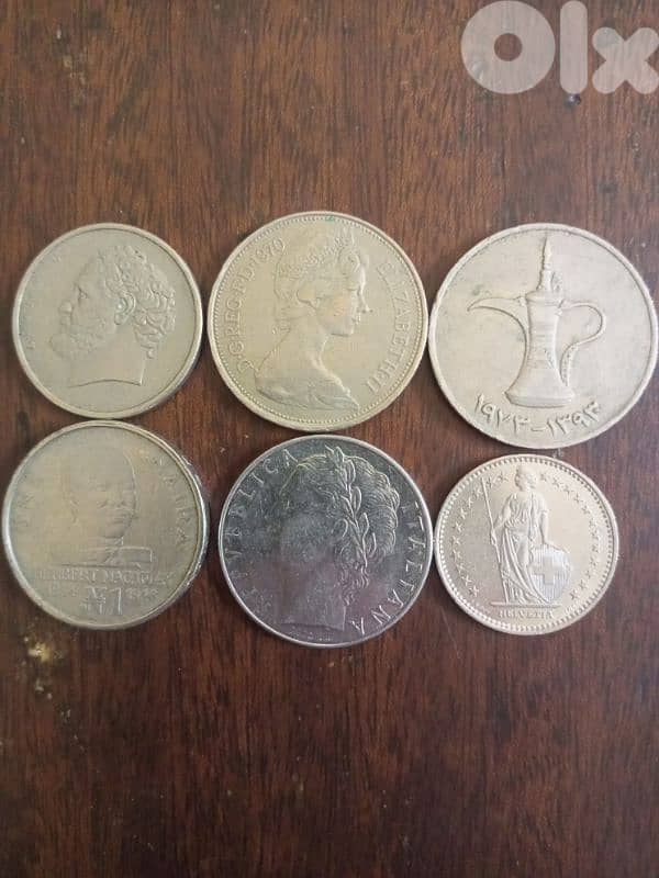 A set of six ancient coins from different countries. 0