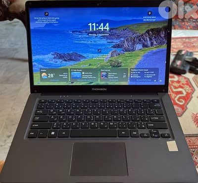 Thomson laptop with charger box and bag  never used