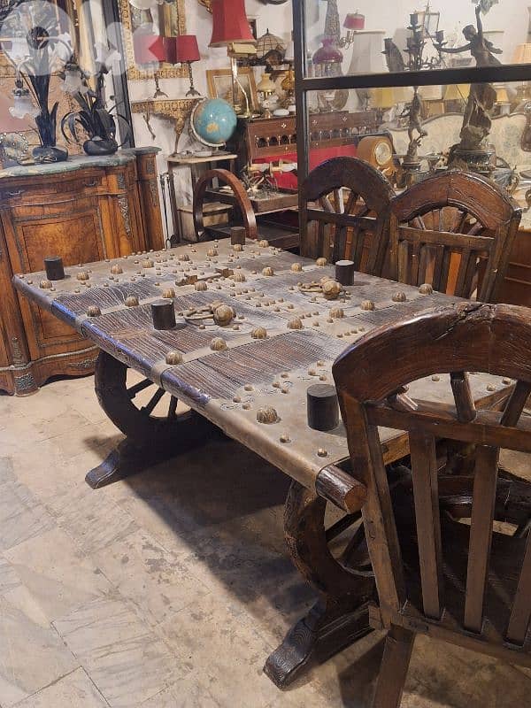unique vintage bronze and massif door face dining table with 8 chairs 1