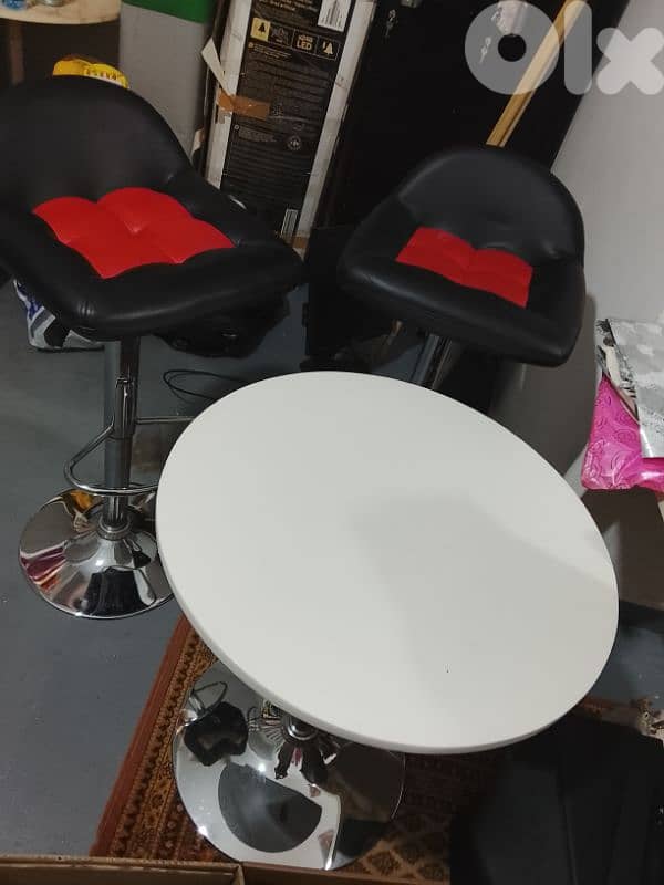 two chairs with a table 1