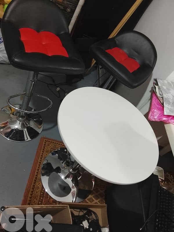 two chairs with a table 2