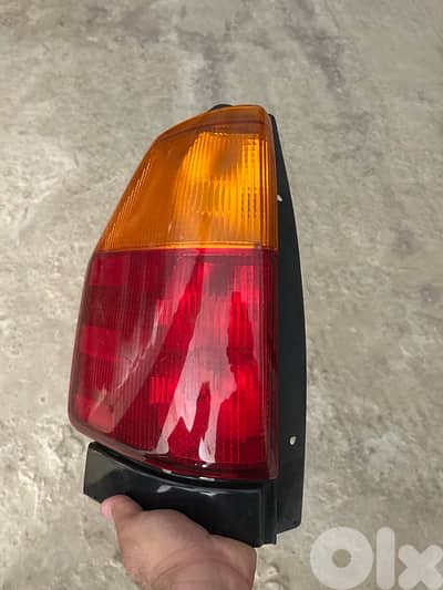 GMC Envoy tail light Left still new ضوّ ستوب خلفي شمال