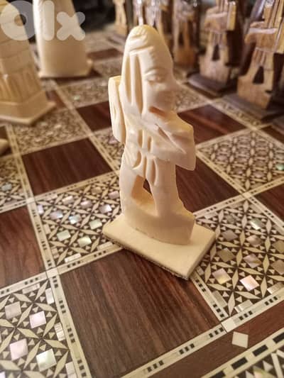 elegant chess board with inlaid ivory-style pieces