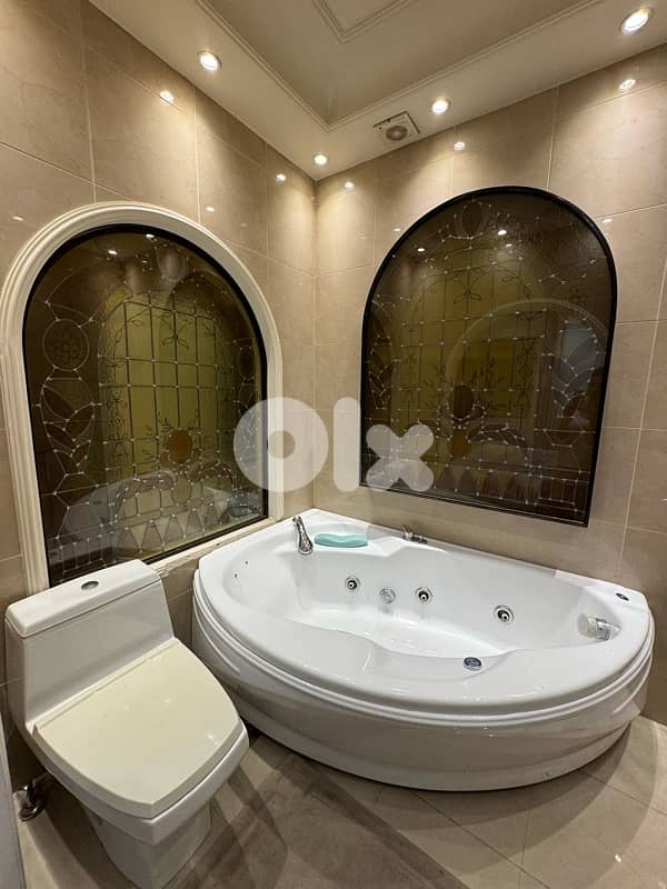 jaccuzi , wall painted glass and toilet 0