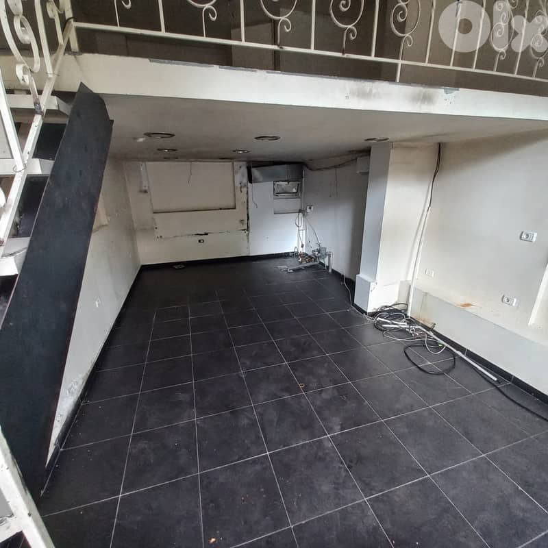 Shop with hoot and mezzanine in Jal el dib for rentمحل تجاري مع شافط 0