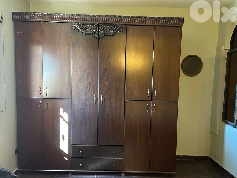 Big wooden closet with hangers and shelves 1