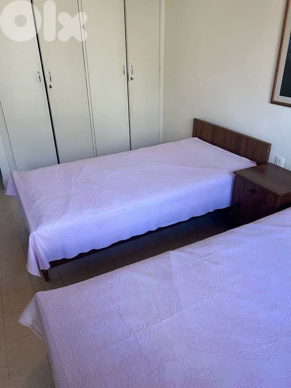 2 single beds + 2 mattresses + nightstand in good condition 3