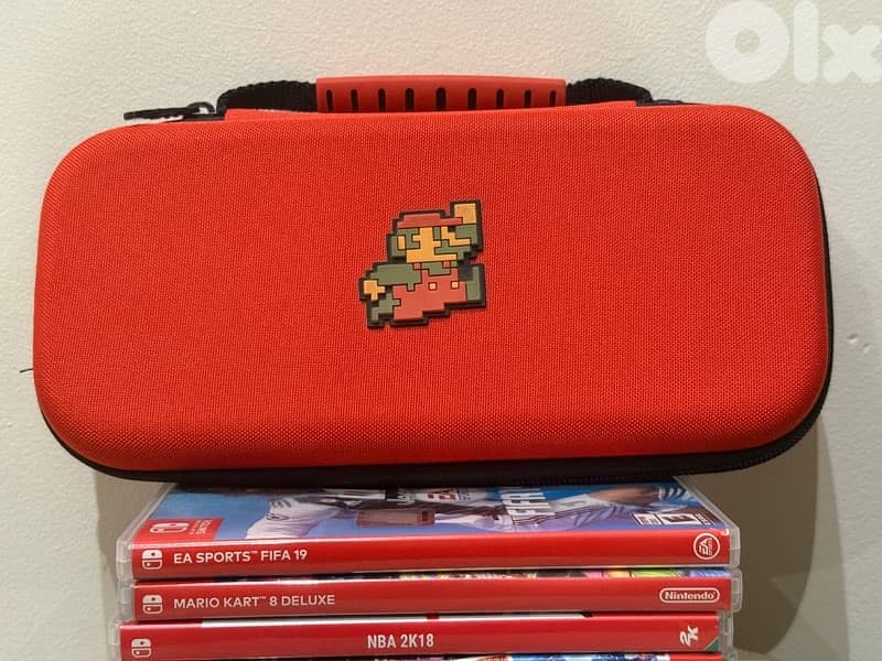 Nintendo switch (Accessories)  + bag + 6 CDS 3