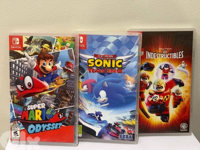 Nintendo switch (Accessories)  + bag + 6 CDS 4