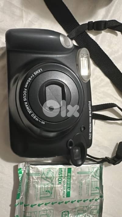 like new Insta Camera- Fujifilm instax210  + film + sony bag