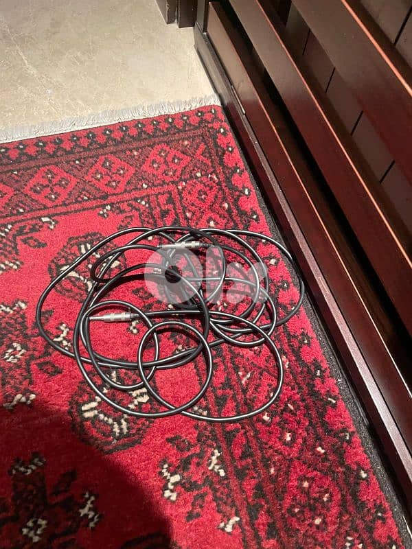 red on white stratocaster with amp and cables 5