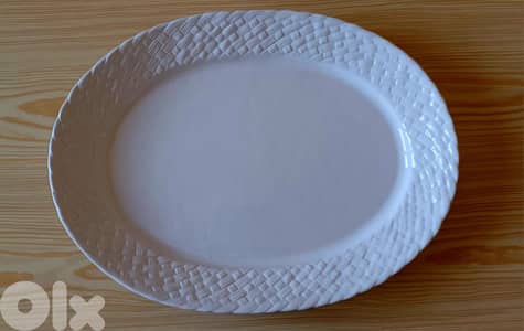 White ceramic serving platter with basket-weave rim